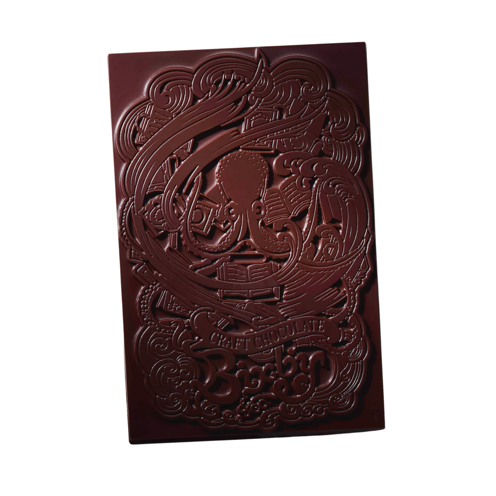 A rectangular chocolate bar embossed with an intricate design featuring an octopus, books, and the words CRAFT CHOCOLATE.