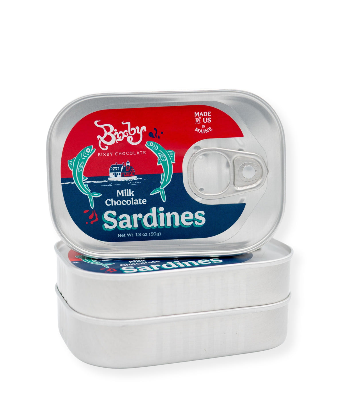 A silver tin of Bixby Chocolates’ Chocolate Sardines, featuring a colorful fish design and pull-tab, sits atop another. This quirky Maine souvenir contains only artisanal chocolate—no real sardines inside!.