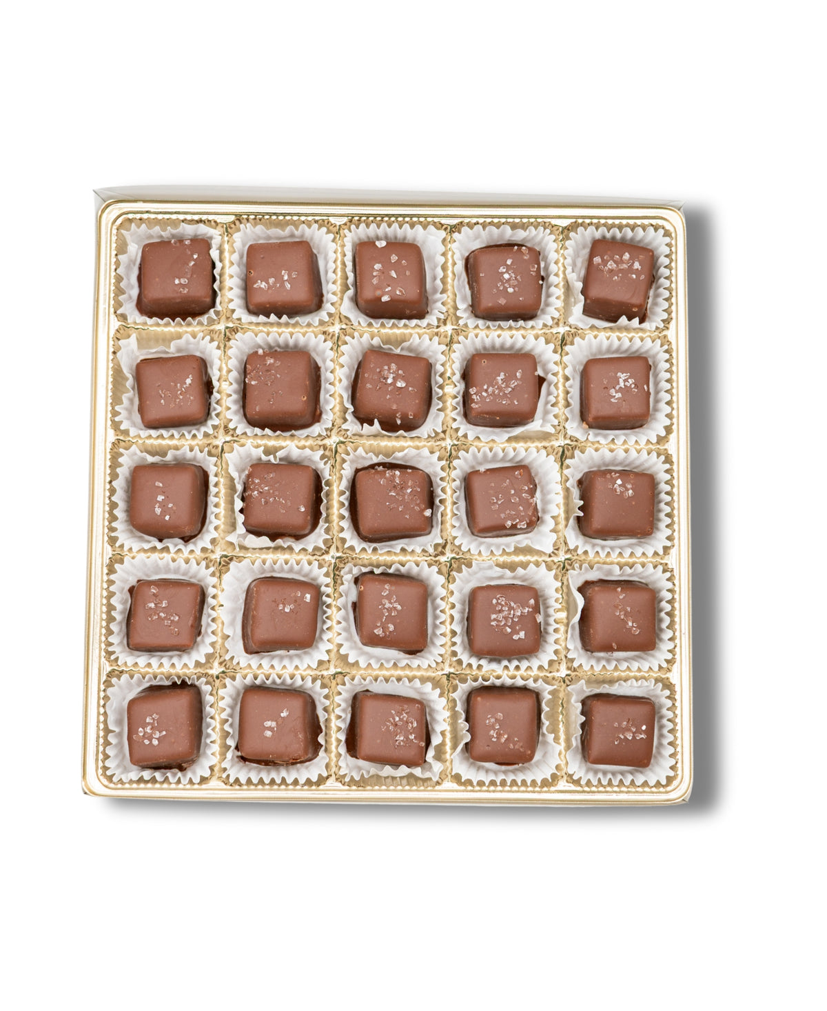 The Bixby Chocolates Chocolate Sea Salted Caramels Gift Box features 25 milk chocolate caramels topped with sea salt, each in its own paper wrapper, elegantly arranged in a white square gift box.