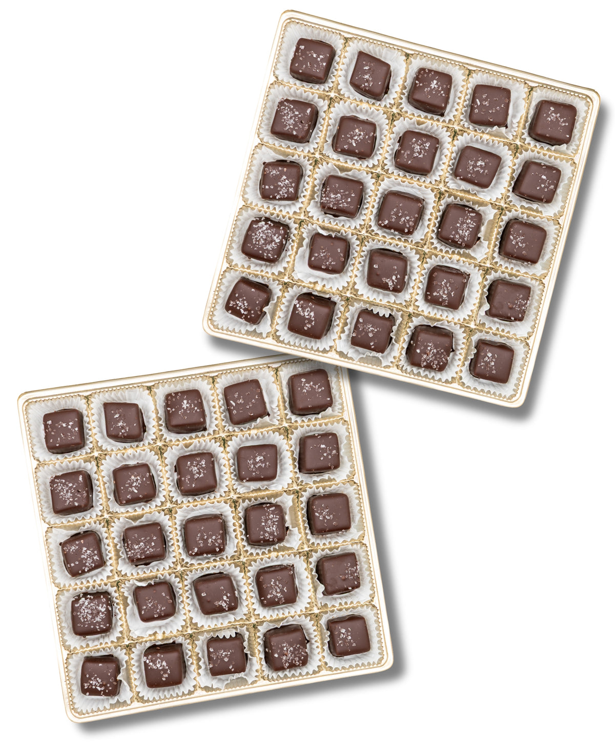 Two open Bixby Chocolates Chocolate Sea Salted Caramels Gift Boxes, each with 25 square caramels in a 5x5 grid. Every caramel is topped with sea salt and placed in a white paper cup—an irresistible chocolate gift.