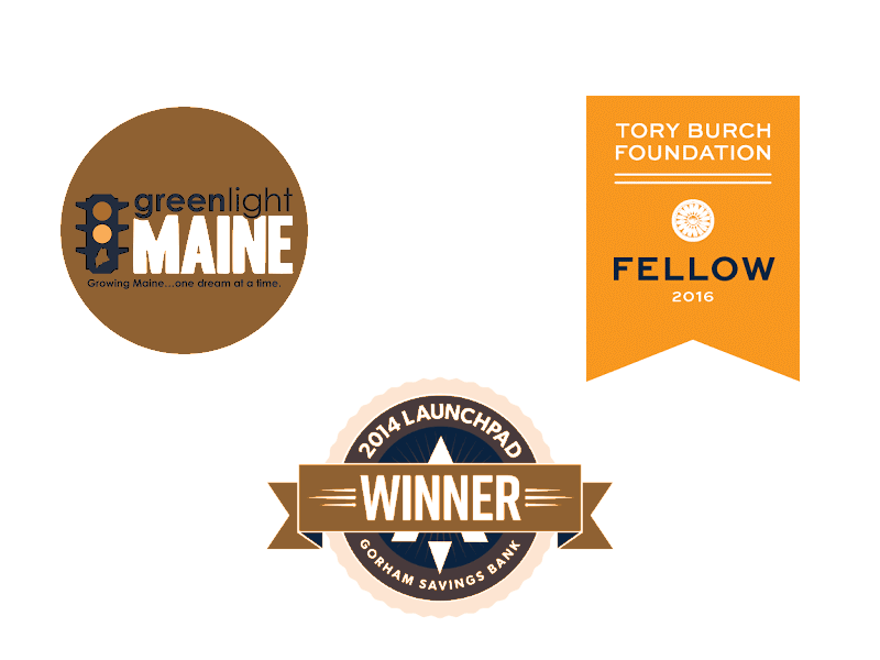 Three achievement badges: the Greenlight Maine logo, a Tory Burch Foundation 2016 Fellow ribbon, and a 2014 Gorham Savings Bank Launchpad Winner seal, all on a white background.