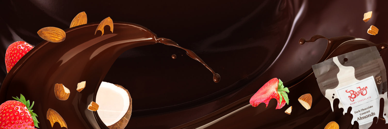 A splash of rich dark chocolate with whole and chopped almonds, strawberries, and coconut pieces swirling around, alongside a partially visible chocolate snack package on the right.