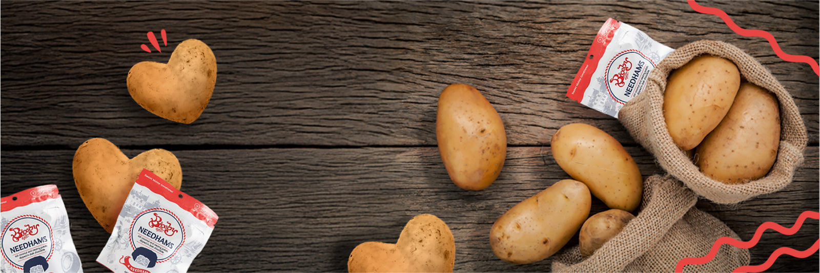A burlap sack spills potatoes onto a wooden surface. Some potatoes are heart-shaped, and a few packets of branded seasoning are visible in the scene, with red graphic accents.