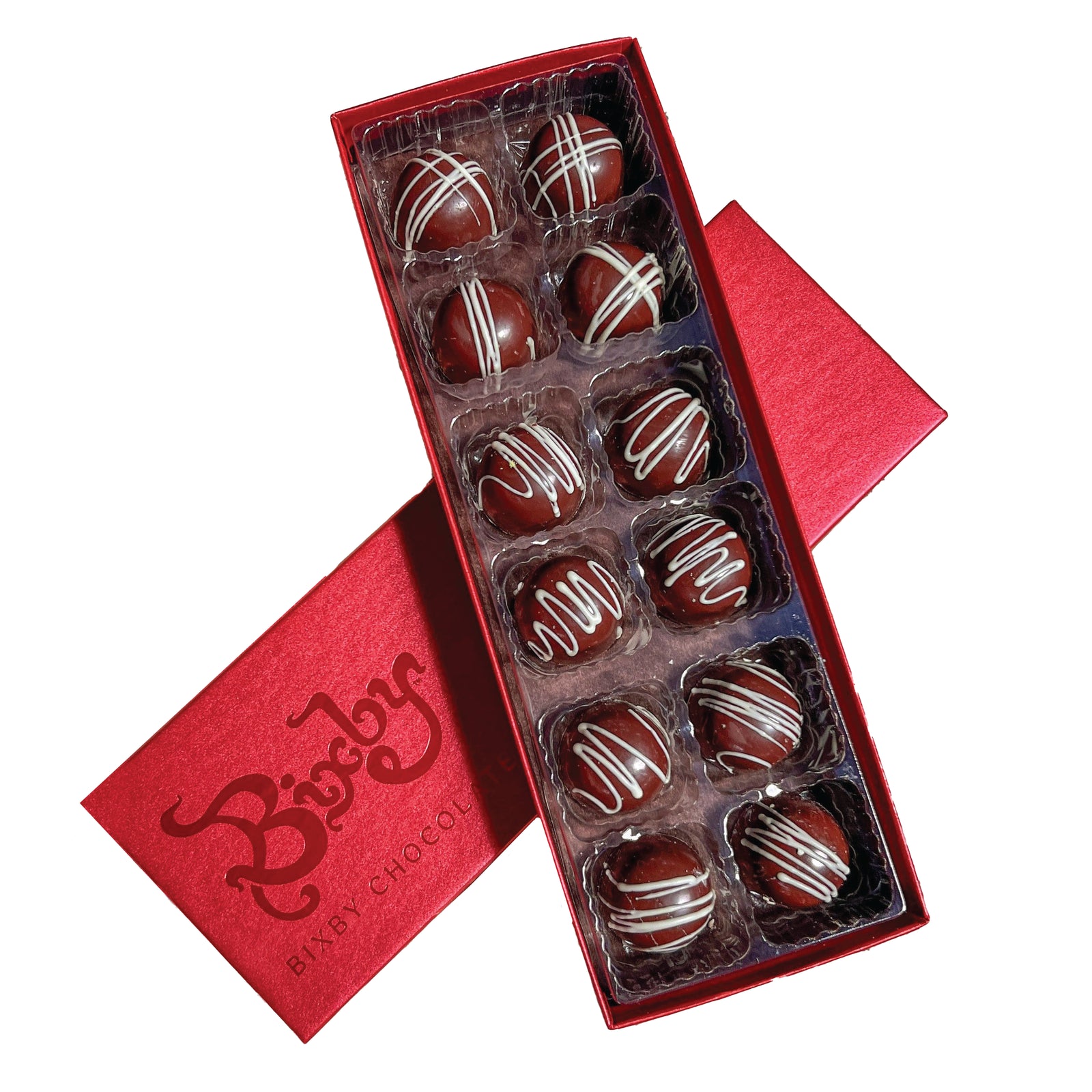 An open red Bixby Chocolates box displays twelve Espresso Dark Chocolate Bon Bon Gift Box truffles with white chocolate drizzle, each in a separate compartment. The slightly ajar lid features the Bixby logo.