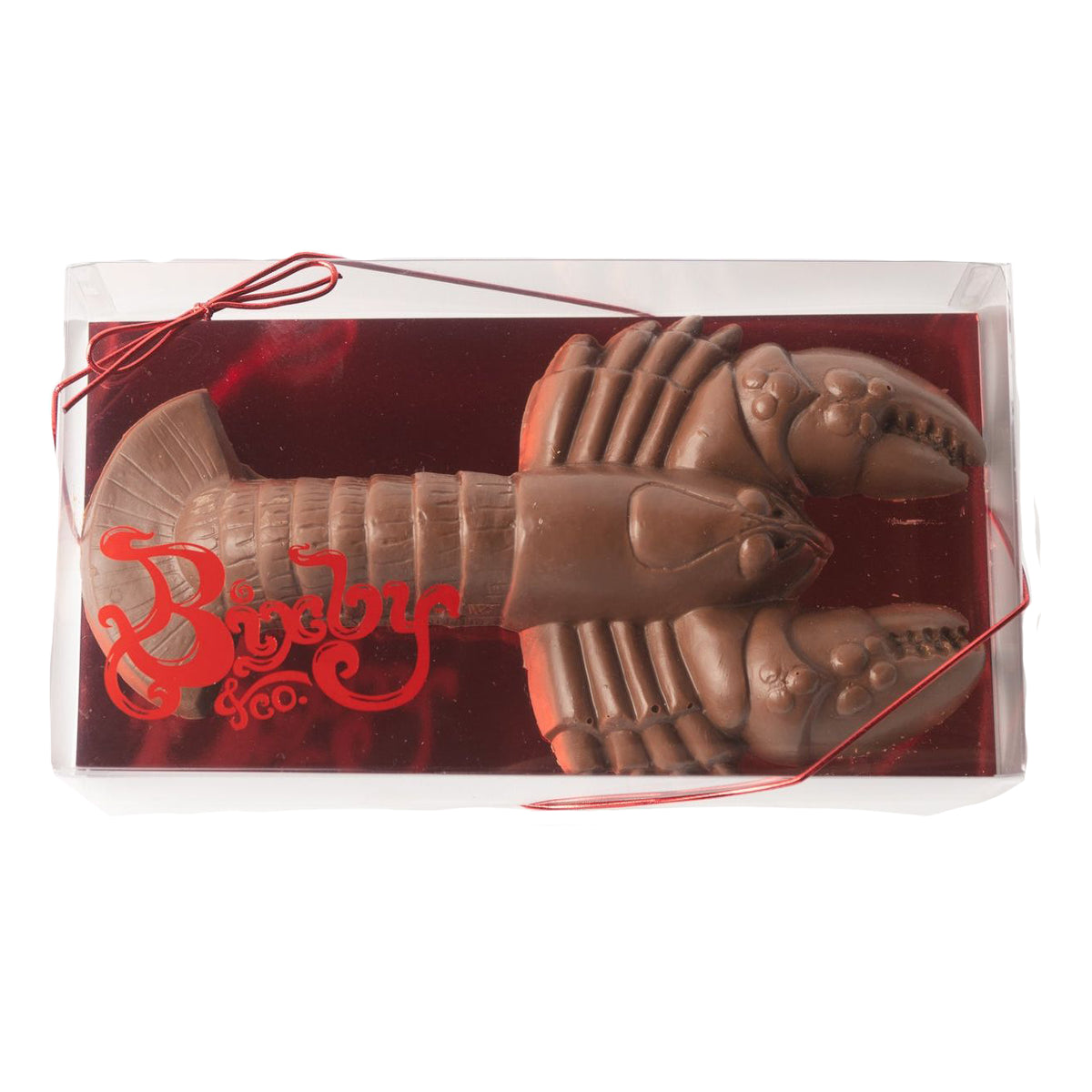 A molded Milk Chocolate 1 Lb Lobster by Bixby Chocolates sits in a clear rectangular box with red trim—an iconic Maine gift for chocolate lovers.