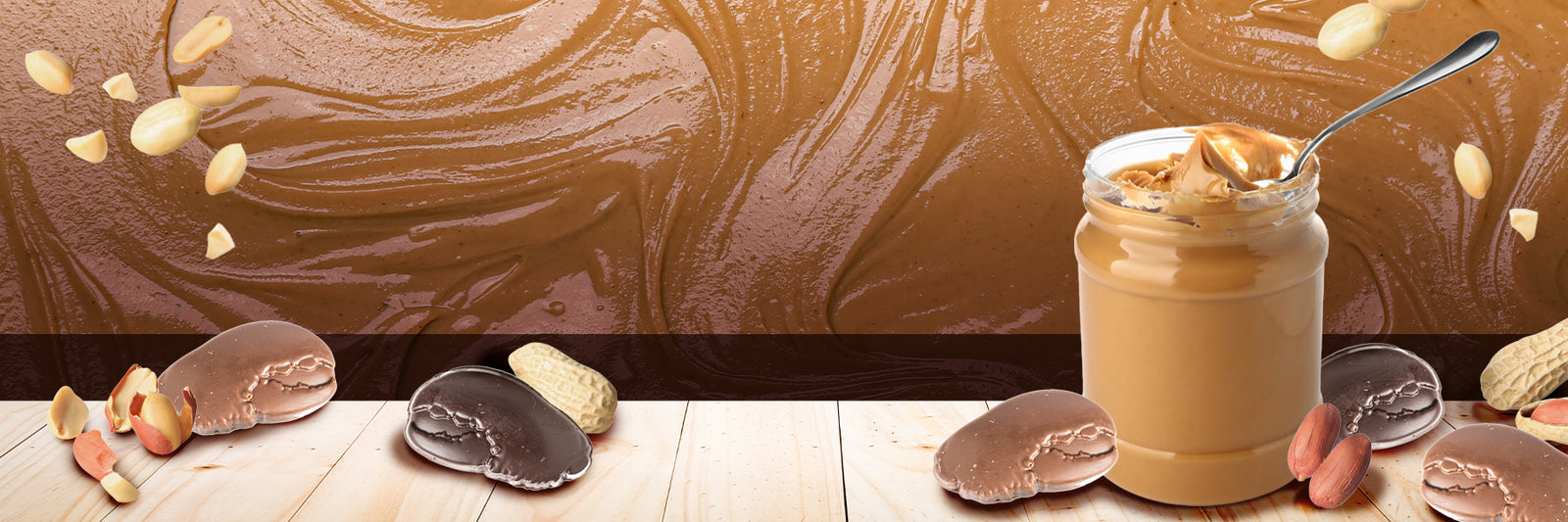 A jar of creamy peanut butter with a spoon sits on a wooden surface, surrounded by chocolate candies, whole and shelled peanuts, with a swirled peanut butter background.