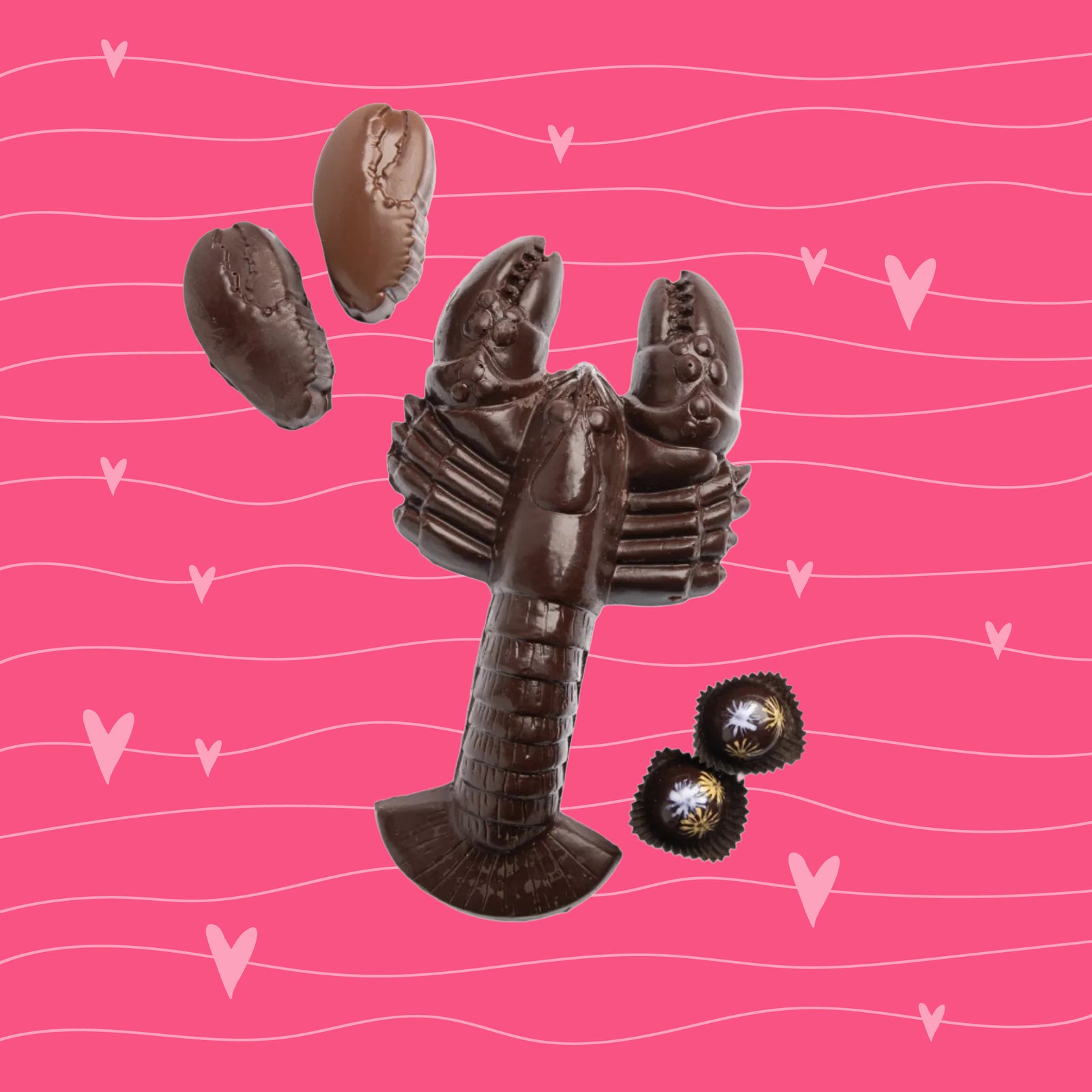 A large chocolate shaped like a lobster is displayed on a pink background with hearts and wavy lines, accompanied by chocolate claws and two small wrapped chocolates.
