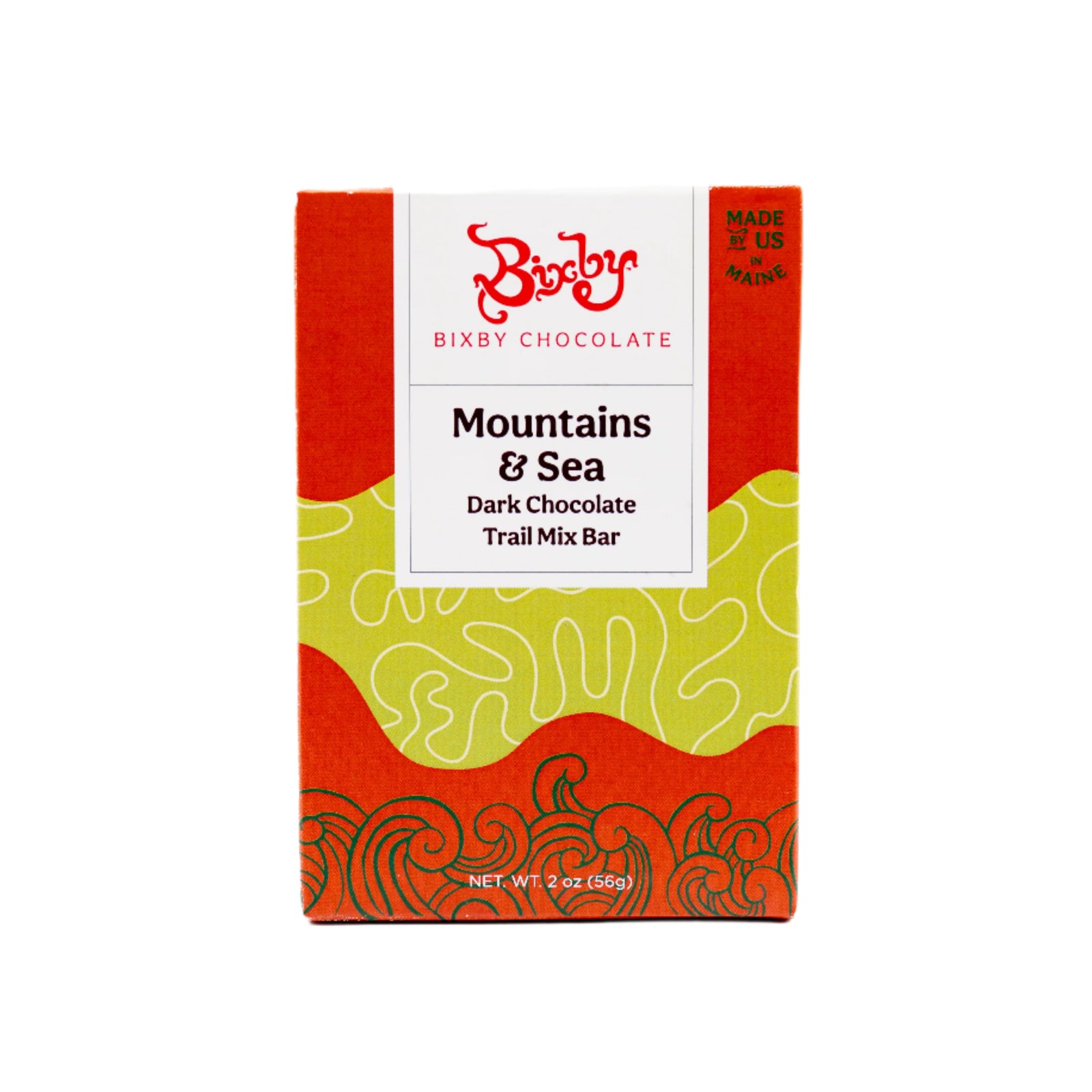 Front of a Bixby Chocolates package labeled Mountains + Sea Trail Mix 70% Dark Chocolate Bar, with a white label, red and green abstract design, net weight 2 oz (56g), and described as a wild blueberry snack and dark chocolate energy bar.