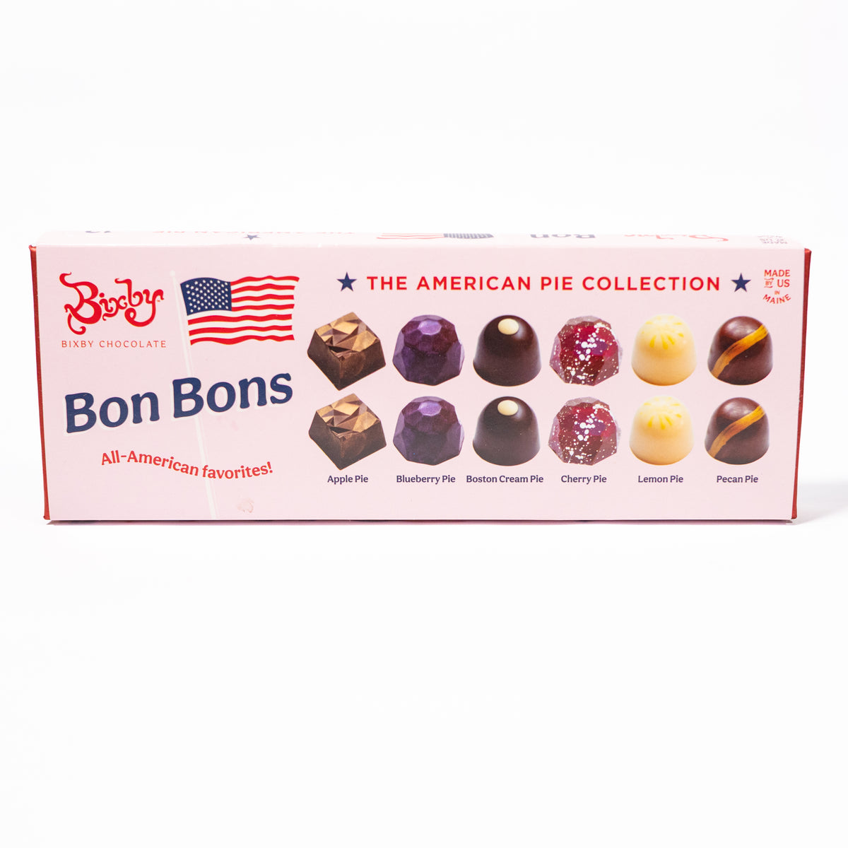 A box of Boston Cream Chocolate Bonbons from 'The American Pie Collection' on a clean white background. The pink box features illustrations of various chocolate bonbons and lists flavors like Apple Pie, Blueberry Pie, Boston Cream Pie, Cherry Pie, Lemon Pie, and Pecan Pie.