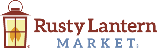 Logo for Rusty Lantern Market featuring a stylized lantern with a flame on the left, and the words Rusty Lantern in brown and Market in blue to the right of the lantern.