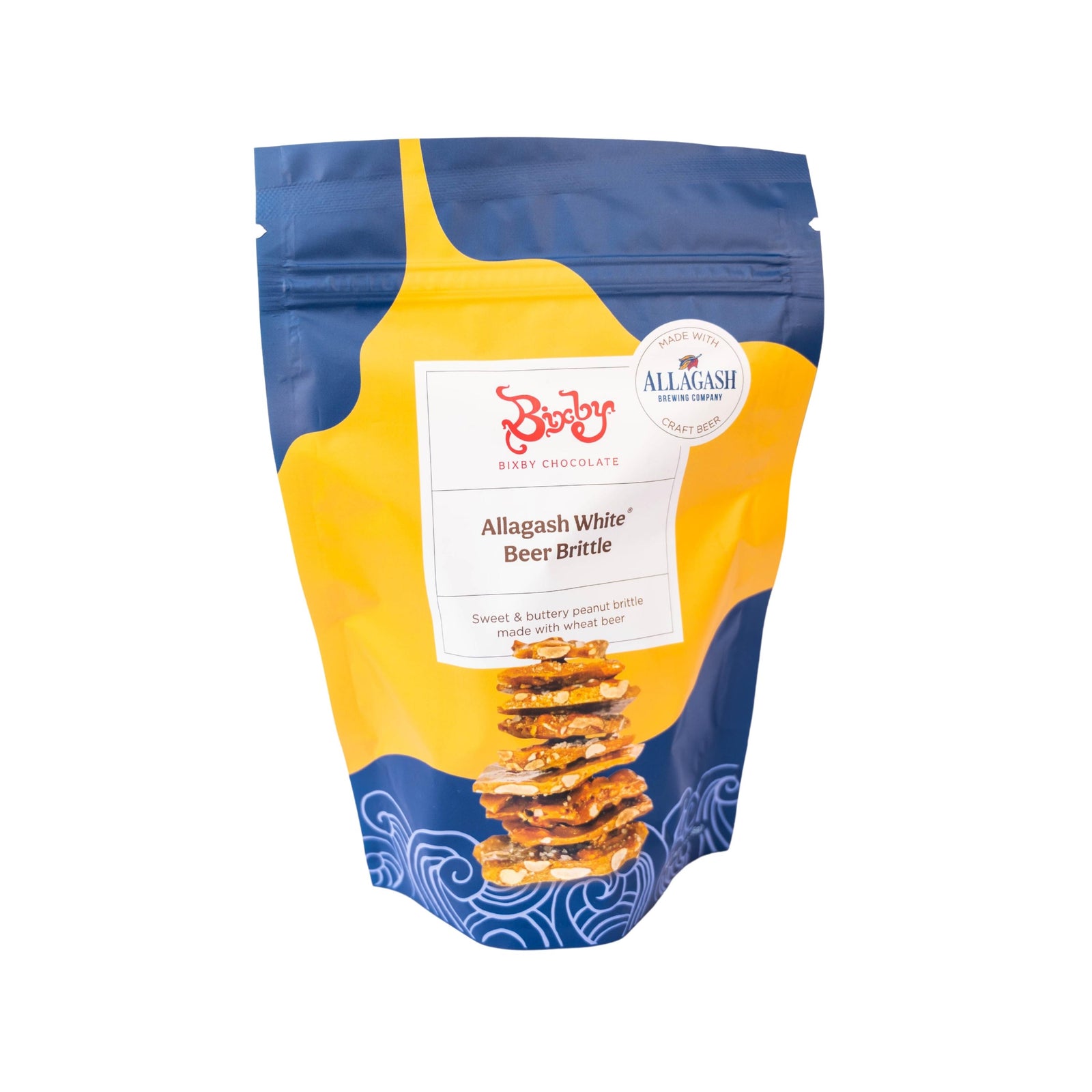 A vibrant pouch of Bixby Chocolates Allagash Beer Brittle displays a stack of brittle on the front with bold yellow and blue abstract art, Maine sea salt, and a round Allagash collaboration label at the top.