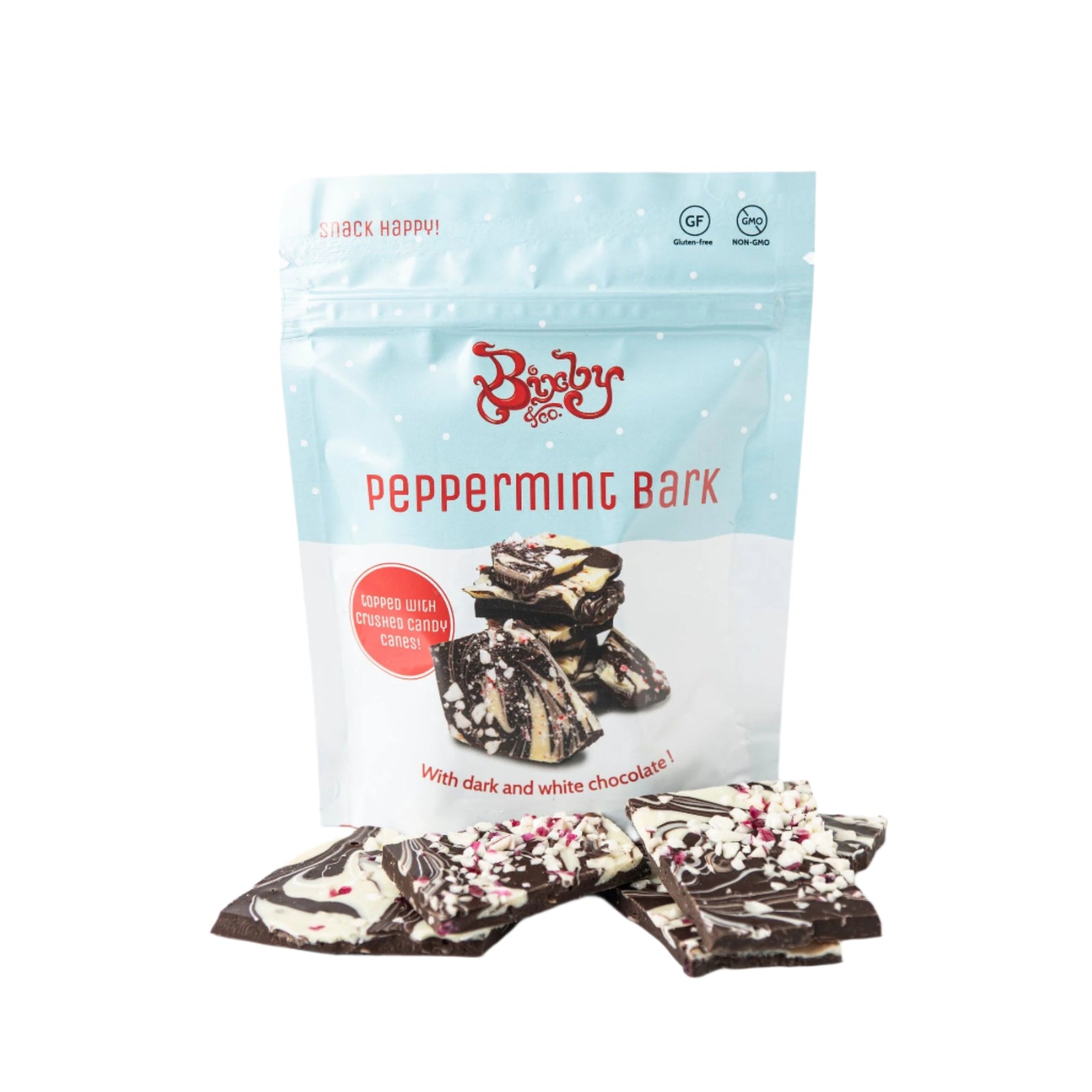 A bag labeled Bixby Chocolates Peppermint Bark sits behind pieces of artisan chocolate bark topped with crushed candy canes. The festive packaging makes it an ideal holiday gift.