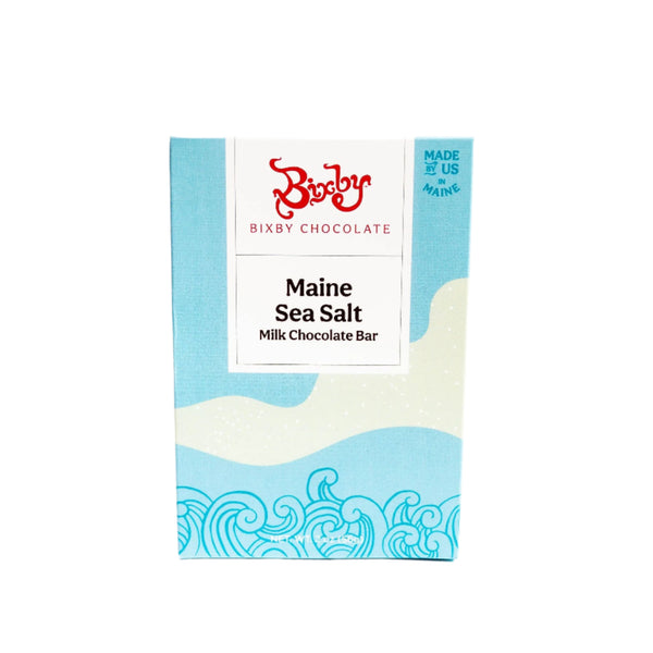 The Organic Milk Chocolate Maine Sea Salt Bar by Bixby Chocolates features blue and cream packaging with wave designs, a Made in Maine label, and highlights bean to bar chocolate crafted with Maine sea salt.