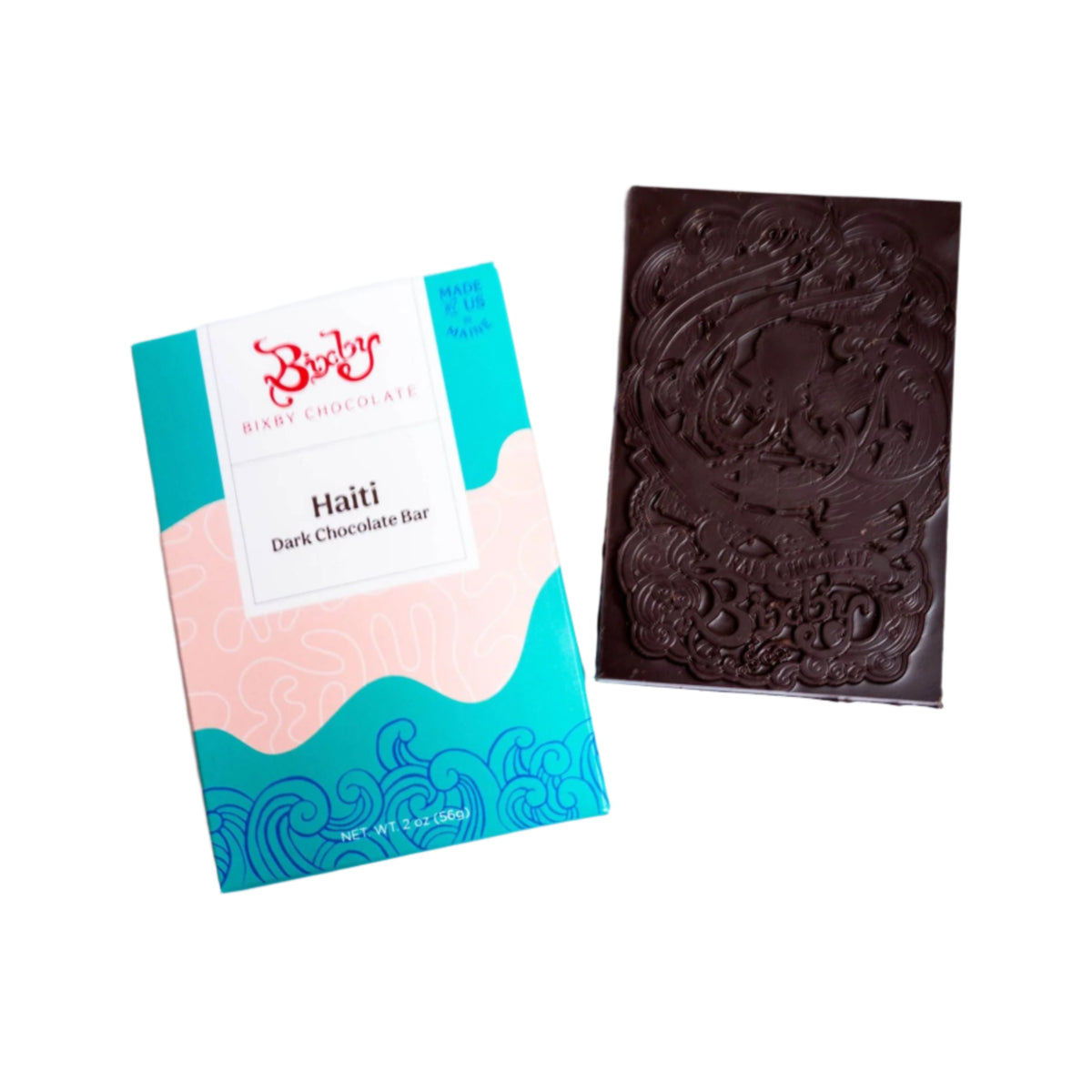 A Bixby Chocolates Organic Haitian 70% Dark Chocolate Bar, in vibrant blue, pink, and white packaging, is displayed beside an unwrapped bar featuring an elegant embossed design.