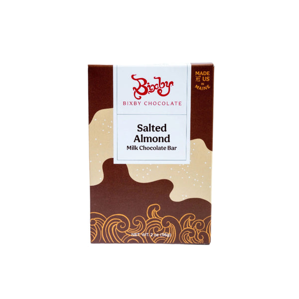 A Bixby Chocolates Milk Chocolate Salted Almond Chocolate Bar with Maine sea salt and roasted almonds, in a brown and cream box with wave designs and a "Made in Maine" label, centered on a white background.