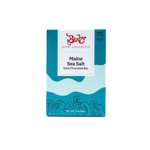 A Bixby Chocolates Organic Dark Chocolate Maine Sea Salt Bar is shown in its packaging with blue ocean wave designs and a white label with red and blue text. This bean to bar chocolate weighs 2 oz (56g).