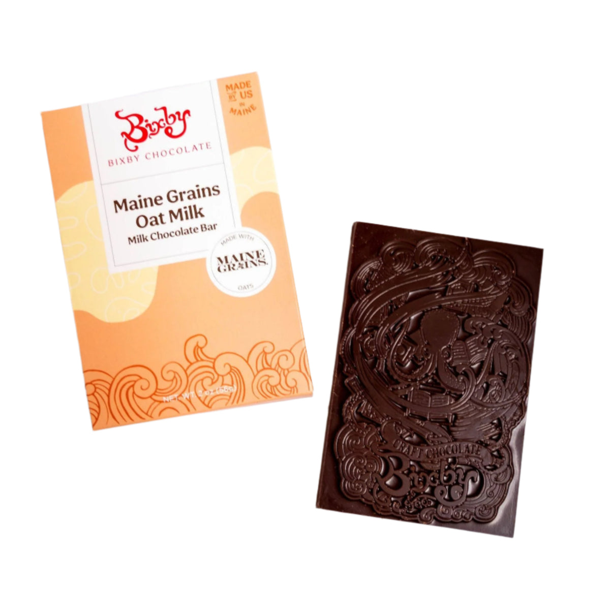 A Bixby Chocolates Organic Maine Grains Oat Milk Chocolate Bar (Vegan) sits beside its orange and cream box, featuring a decorative embossed design with patterns and the Bixby logo.