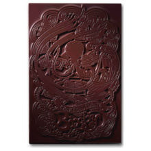 The Organic Belize 70% Dark Chocolate Bar by Bixby Chocolates features intricate swirling designs and stylized text, including "Craft Chocolate" and "Batch," and is made with ethically sourced Belizean cacao.