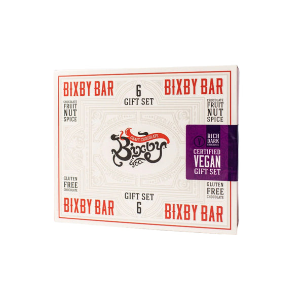 The Vegan Bixby Bar Gift Box by Bixby Chocolates is a 6-bar set featuring certified vegan, organic ingredient bars with gluten-free dark chocolate in fruit, nut, and spice flavors.