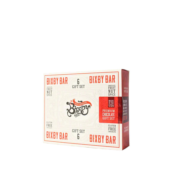 The Bixby Chocolates Assorted Gift Box features 6 gluten-free fruit and nut spice bars, made in the USA in cream packaging with red accents.